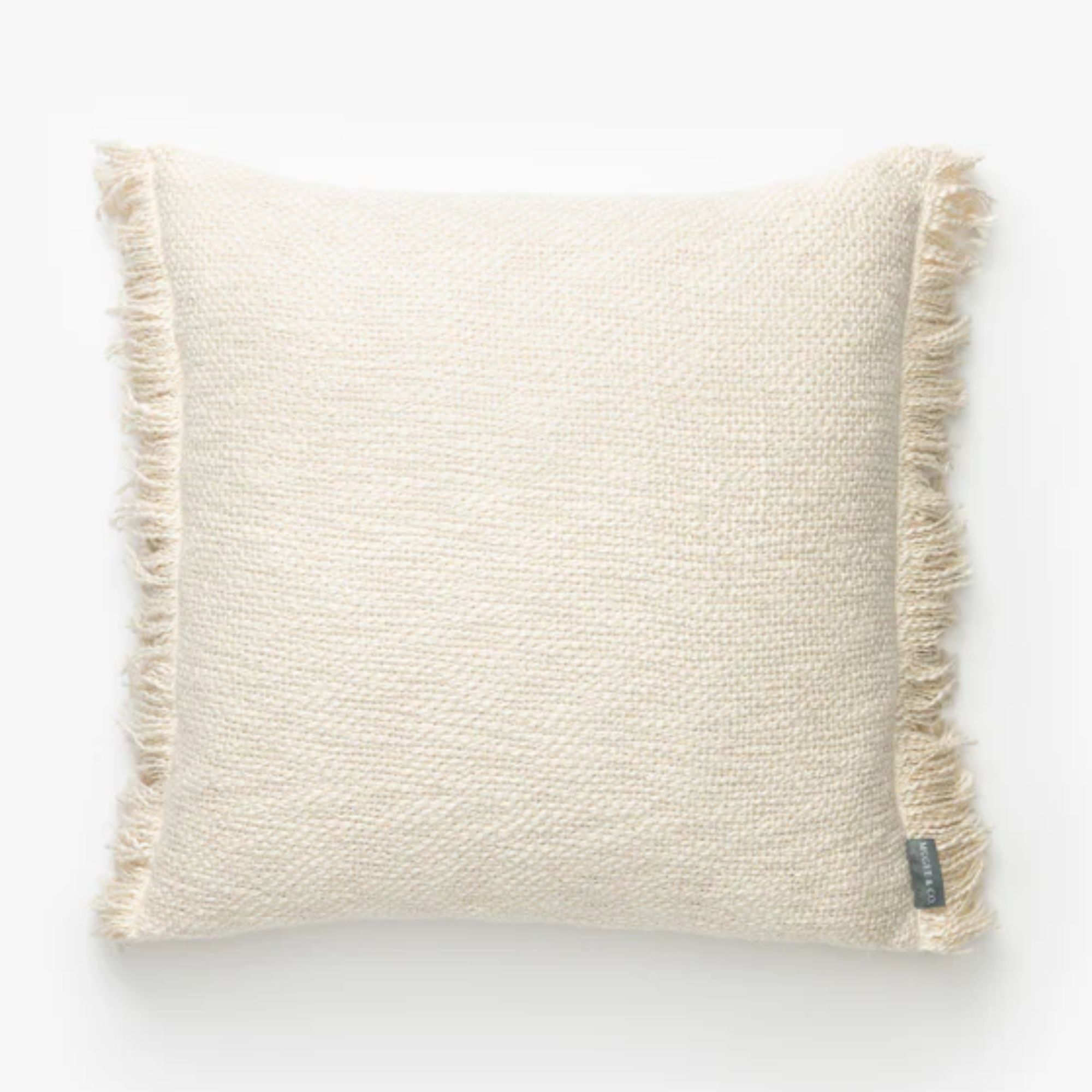 square cream cushion with tassel edge