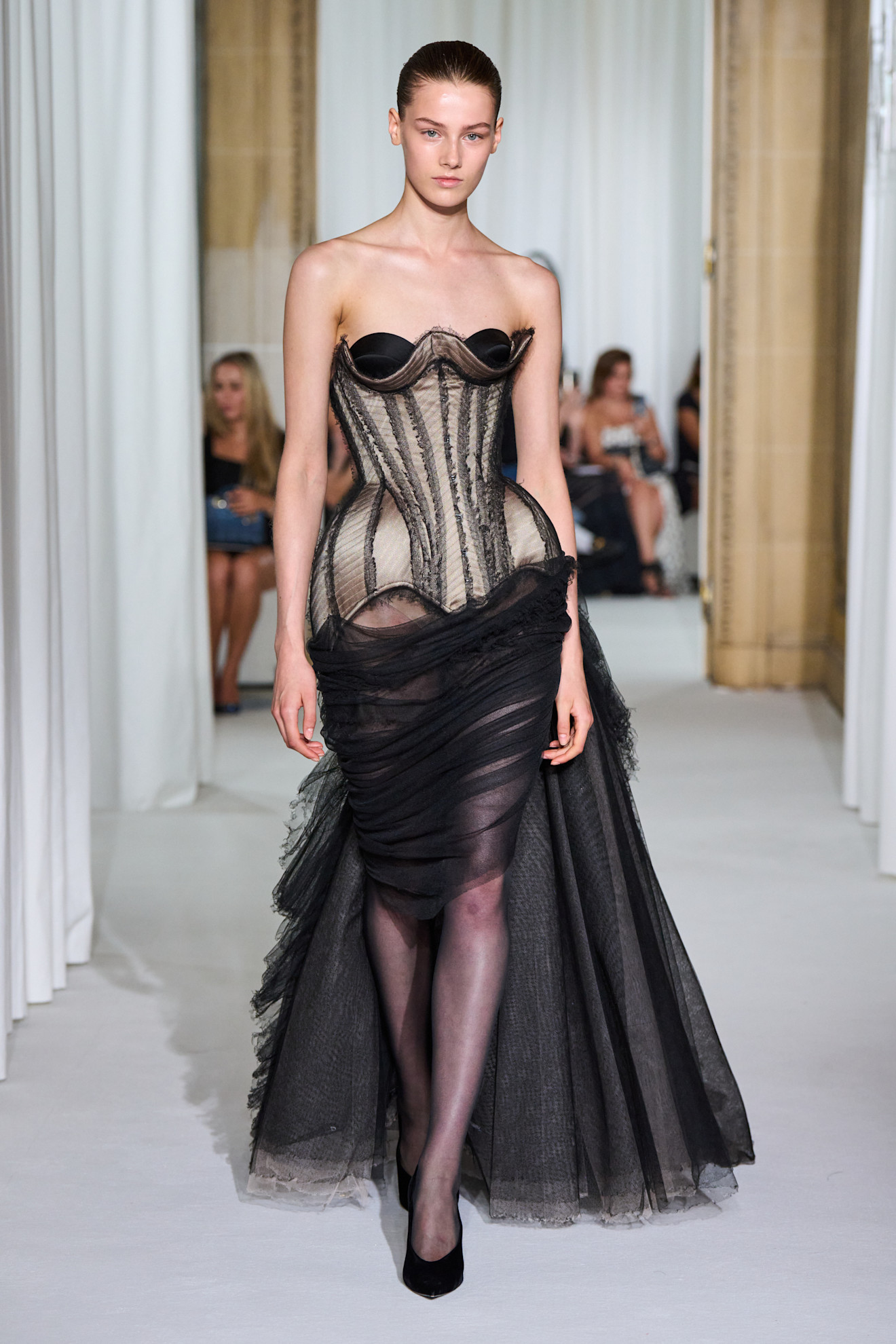 A model wore Millie Bobby Brown's corseted naked gown on the Ashi Studio Fall 2025 Couture runway