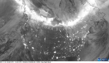 A grayscale map of the US and Canada showing lights where auroras occurred, with a giant light ribbon at the top over Canada.