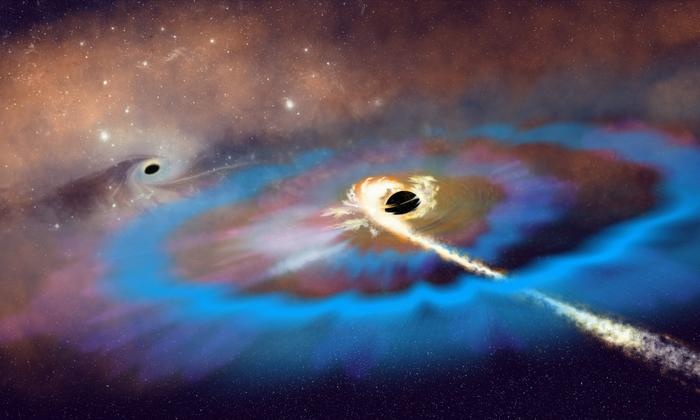 Artist’s interpretation of two massive black holes (MBHs) within a galaxy. Credit: NSF/AUI/NSF NRAO/P.Vosteen