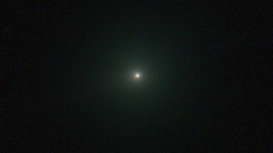 Irradiated Comet 3I/ATLAS glows green and hides its tail in new image