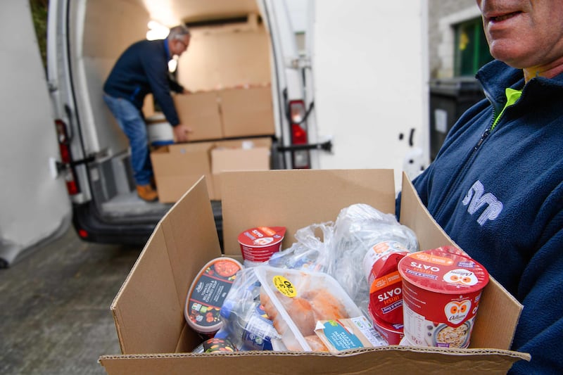 Loading the van with food boxes: 'There are so many stories of socio-economic struggles as we drive to the various locations.' Photograph: Daragh McSweeney/Provision