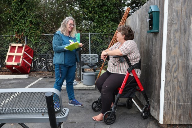 Providence Mobile Health Clinic medical assistant and patient navigator Jesika Quintal, left, talks with Cynthia Sexton during a visit at Studios at Montero supportive housing in Petaluma on Monday, Sept. 29, 2025. (Christopher Chung/The Press Democrat)