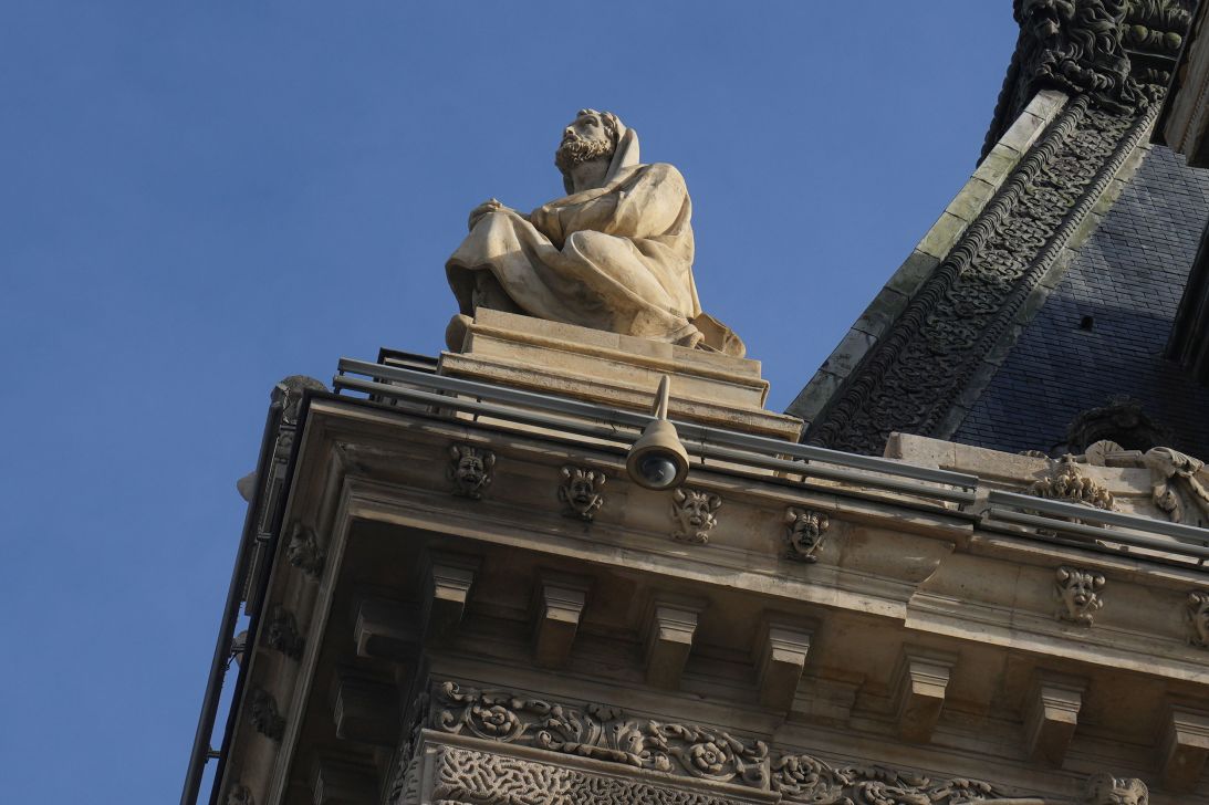 A surveillance camera is seen on the Louvre's facade, three days after the robbery.