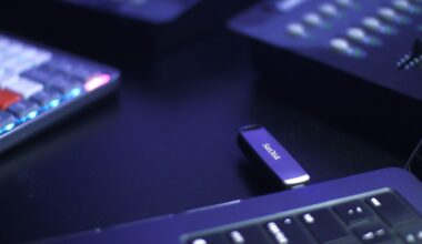 A promotional photograph of a Sandisk USB flash drive protruding from a laptop.