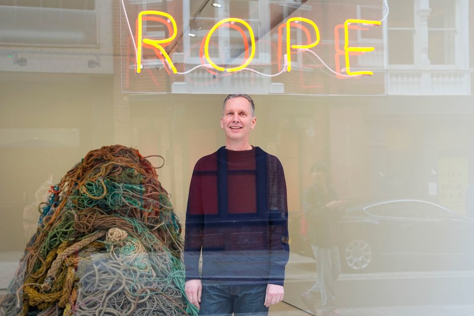 Artist David Shrigley with his new artwork 'Exhibition of Old Rope' at the Stephen Friedman Gallery in central London. Lucy North/PA Wire