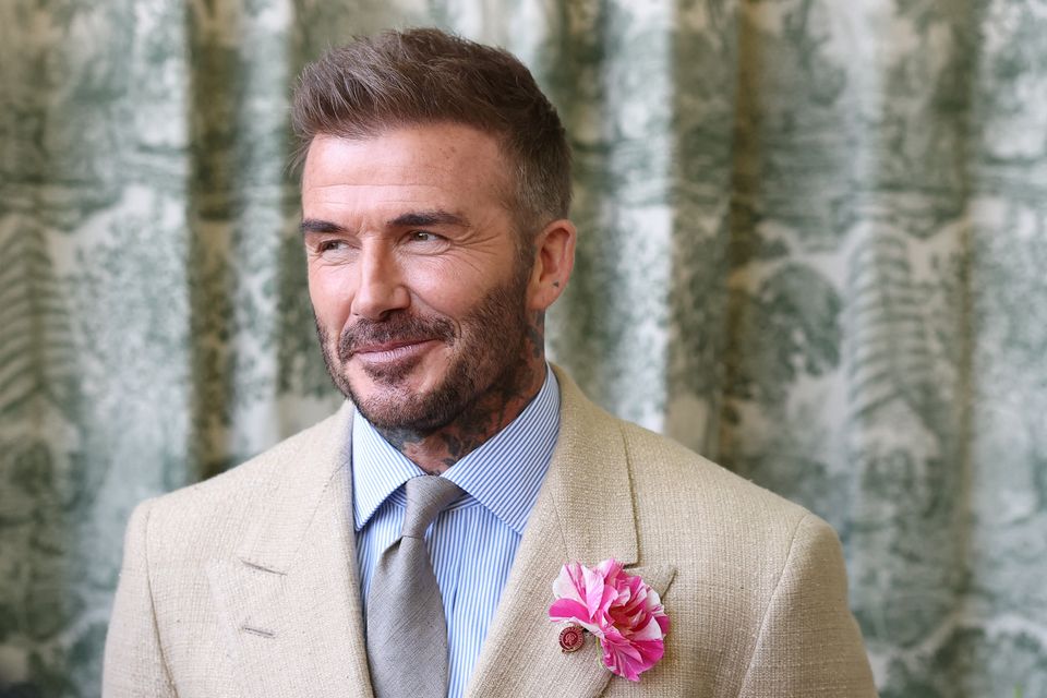 Sir David Beckham will be among those accepting honours at Windsor Castle on Tuesday (Toby Melville/PA)