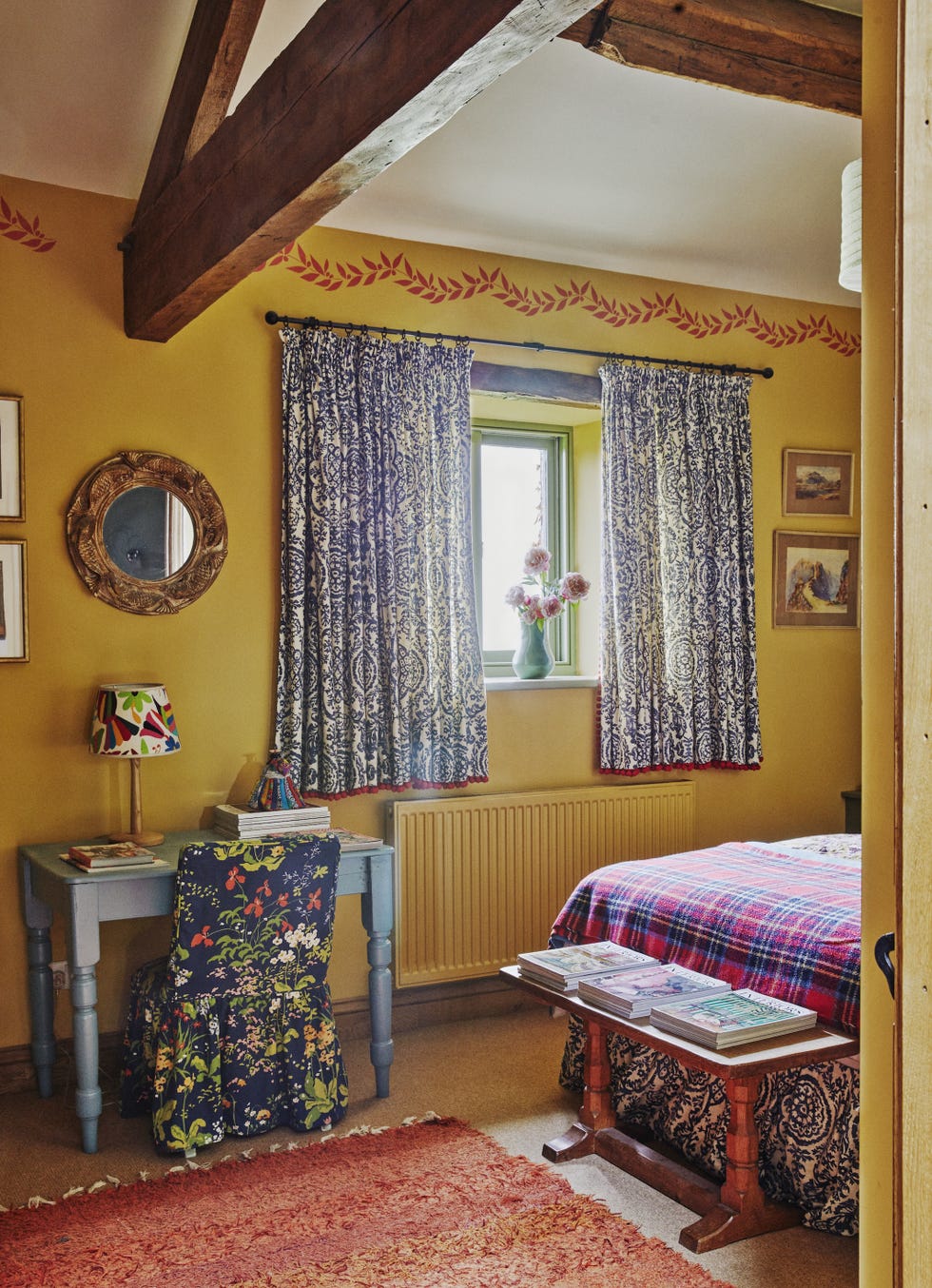 yellow bedroom with stencilled wall border