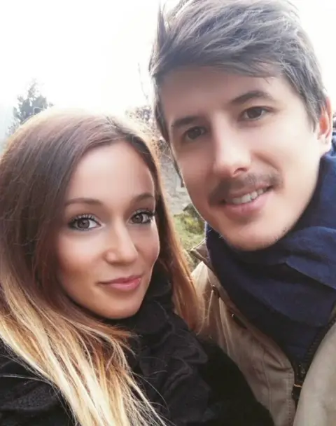 Family handout woman and man looking to camera