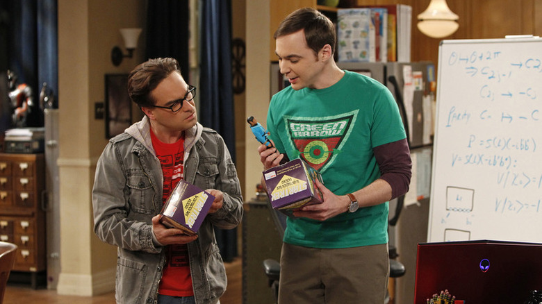 Leonard (Johnny Galecki) and Sheldon (Jim Parsons) observing an action figure on The Big Bang Theory
