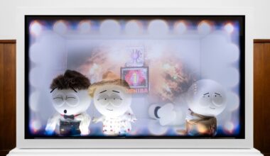 Wang Shu and Lu Wenyu standing in a library