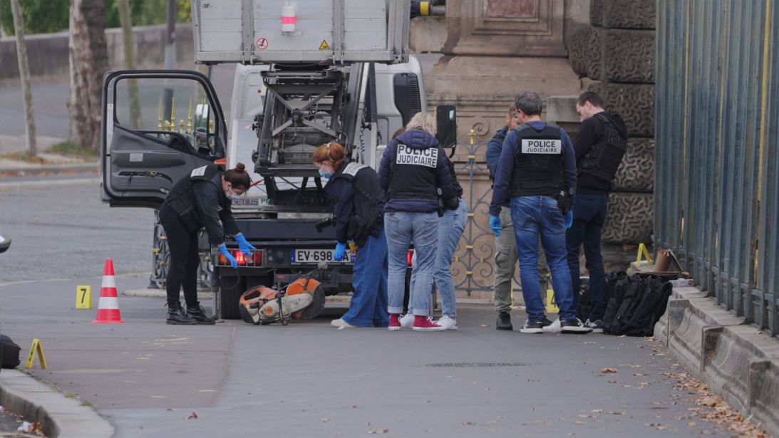 French police inspect and collect objects believed to be left by the perpetrators of the heist.