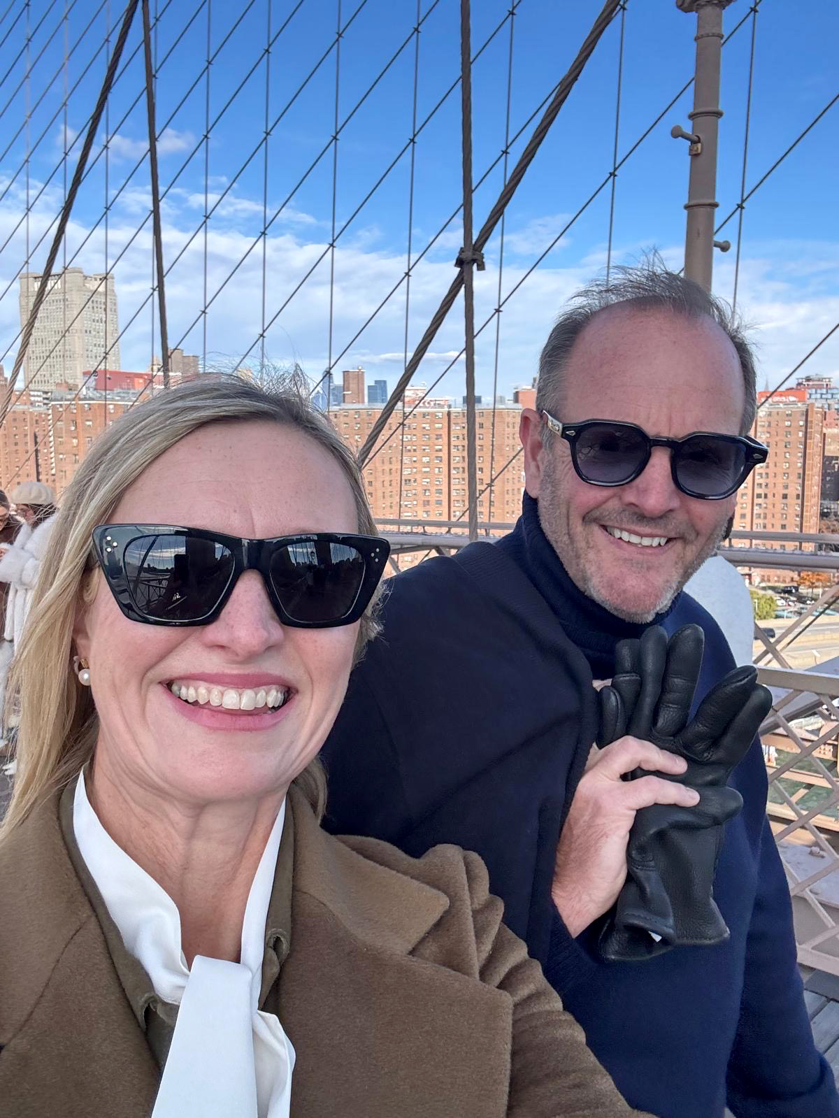 Robin Hall and his wife Stephanie posing for a selfie on the Brooklyn Bridge in New York.