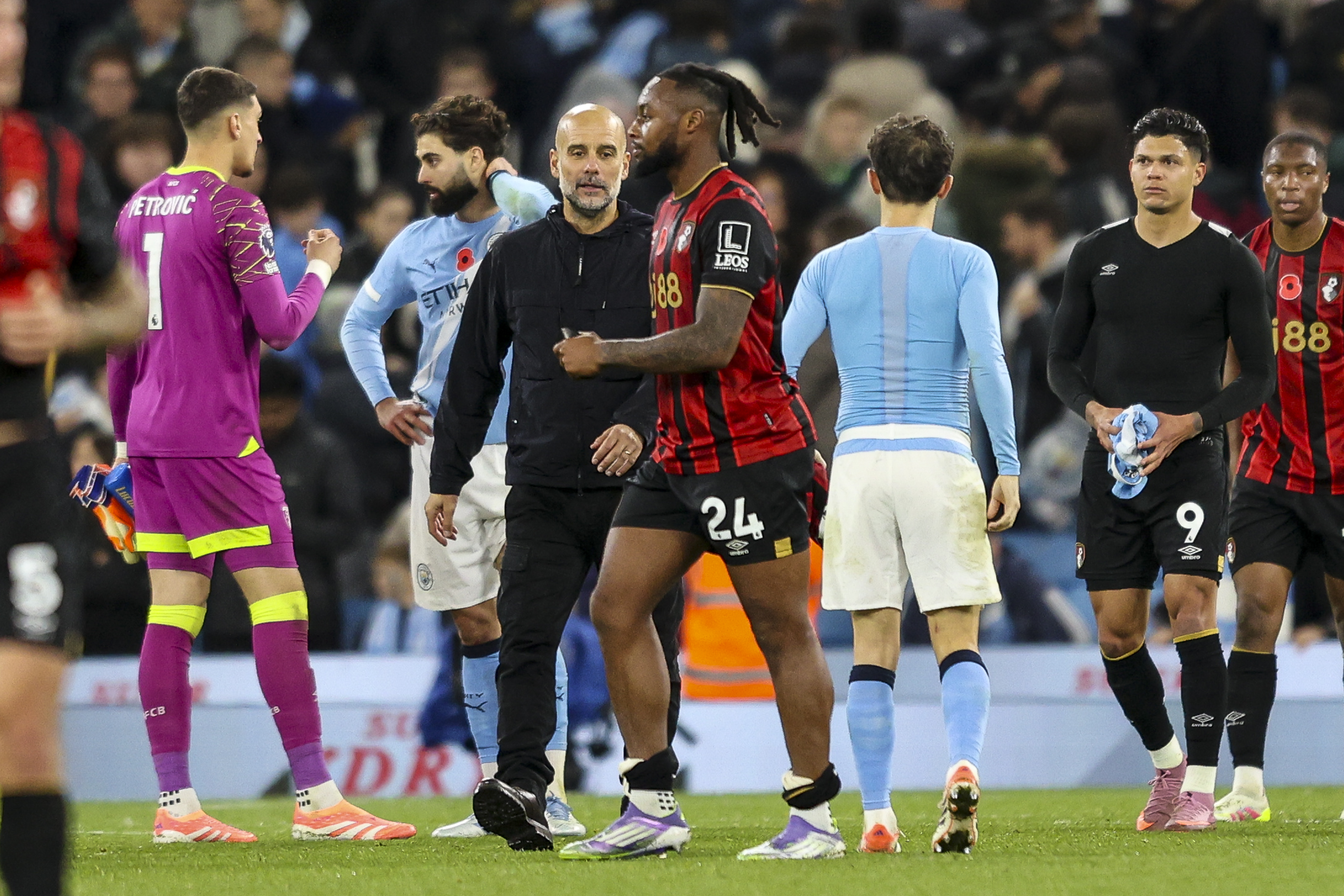 Manchester City Head Coach Pep Guardiola with Bournemouth player Antoine Semenyo after a match.