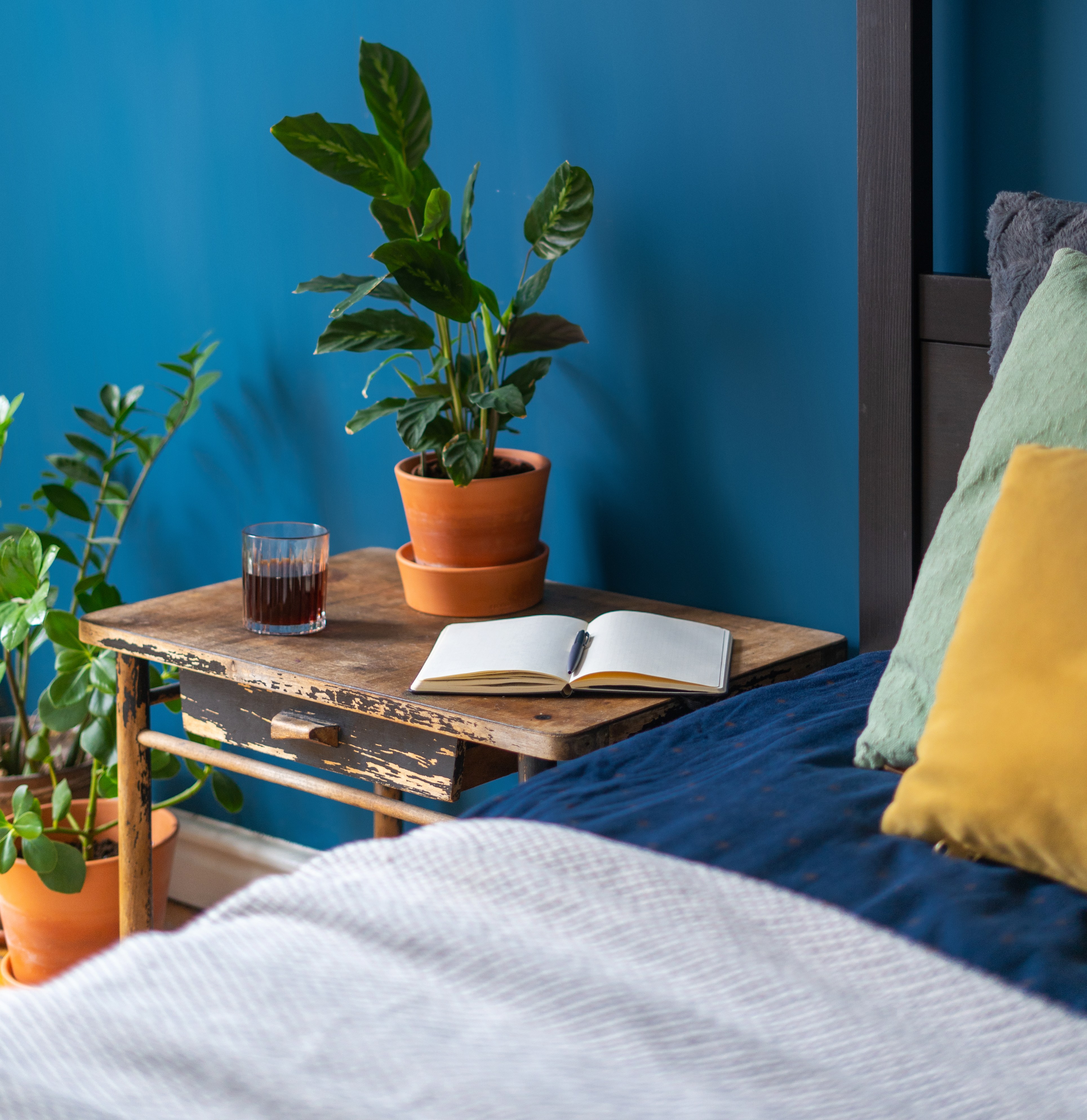 detail of stylish bedroom in house with bohemian interior