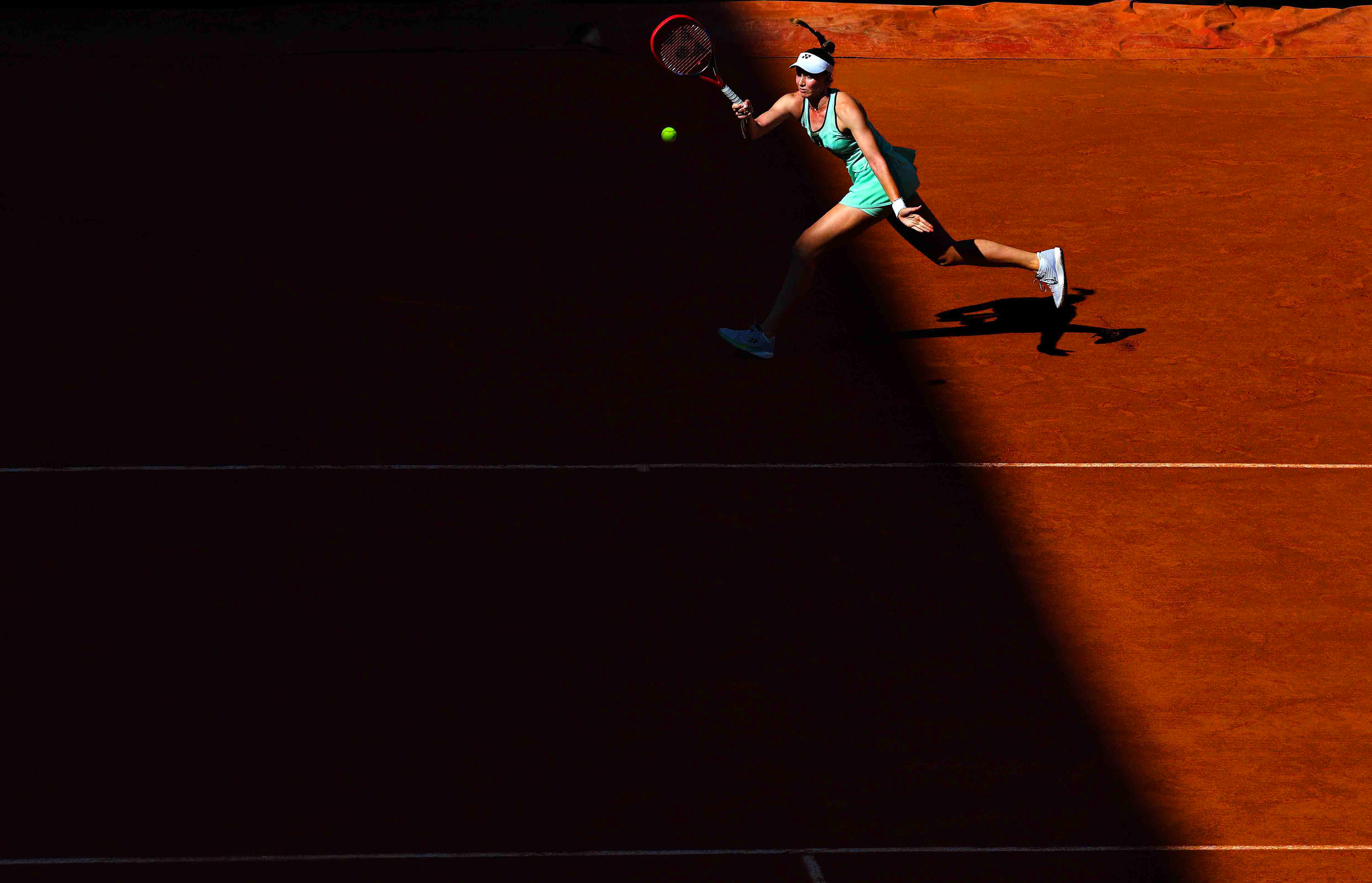 Elena Rybakina in shadows on Court Suzanne Lenglen.