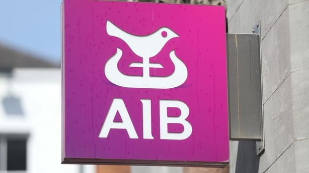The pink AIB logo on the side of a building