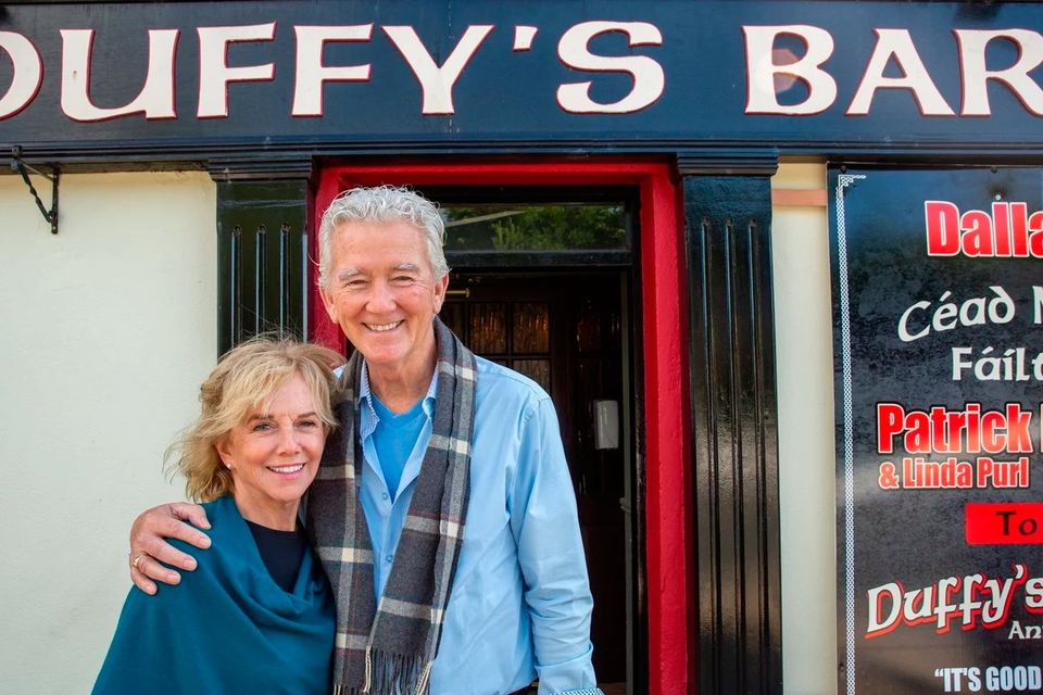 Patrick Duffy and his partner Linda Purl outside Duffy's Bar in Annagry, Co Donegal