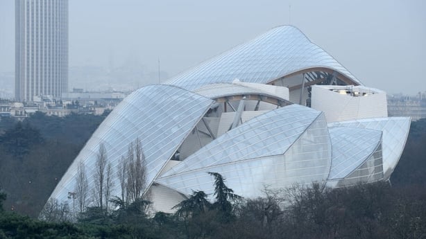 PARIS, FRANCE - DECEMBER 15 : Fondation Louis Vuitton in Bois de Boulogne and Montparnasse tower, Paris, on December 15, 2016 in Paris, France. (Photo by Frédéric Soltan/Corbis via Getty Images)