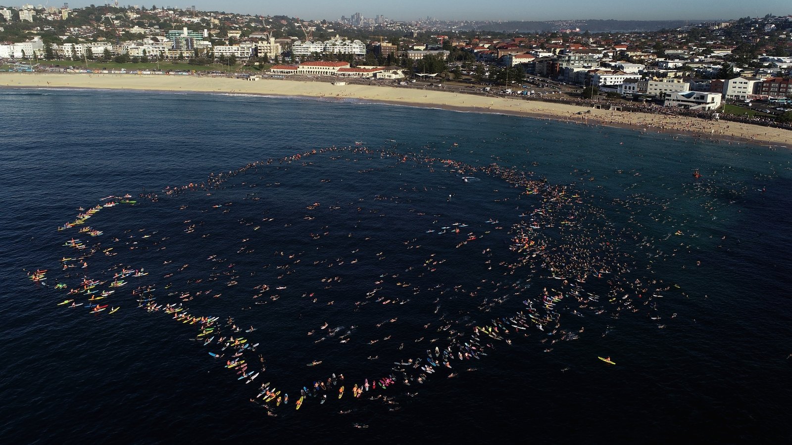 Hundreds swim, float at Bondi Beach to honour victims