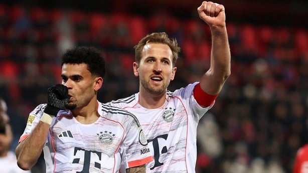 Luis Diaz of Bayern Muenchen celebrates as he scores the goal 0:3 baby cheer with Harry Kane of Bayern Muenchen during the Bundesliga match between 1. FC Heidenheim 1846 and FC Bayern München at Voith-Arena on December 21, 2025 in Heidenheim, Germany.