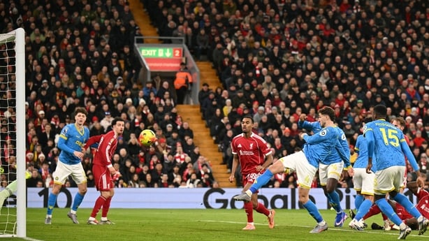 Wolverhampton Wanderers' Uruguayan defender #04 Santiago Bueno scores their first goal during the English Premier League football match between Liverpool and Wolverhampton Wanderers at Anfield in Liverpool, north west England on December 27, 2025.