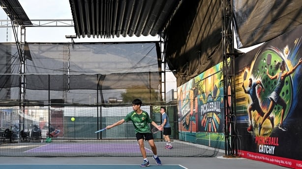 men playing pickleball in a playground 