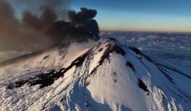Skiers glide down slopes as Mount Etna erupts