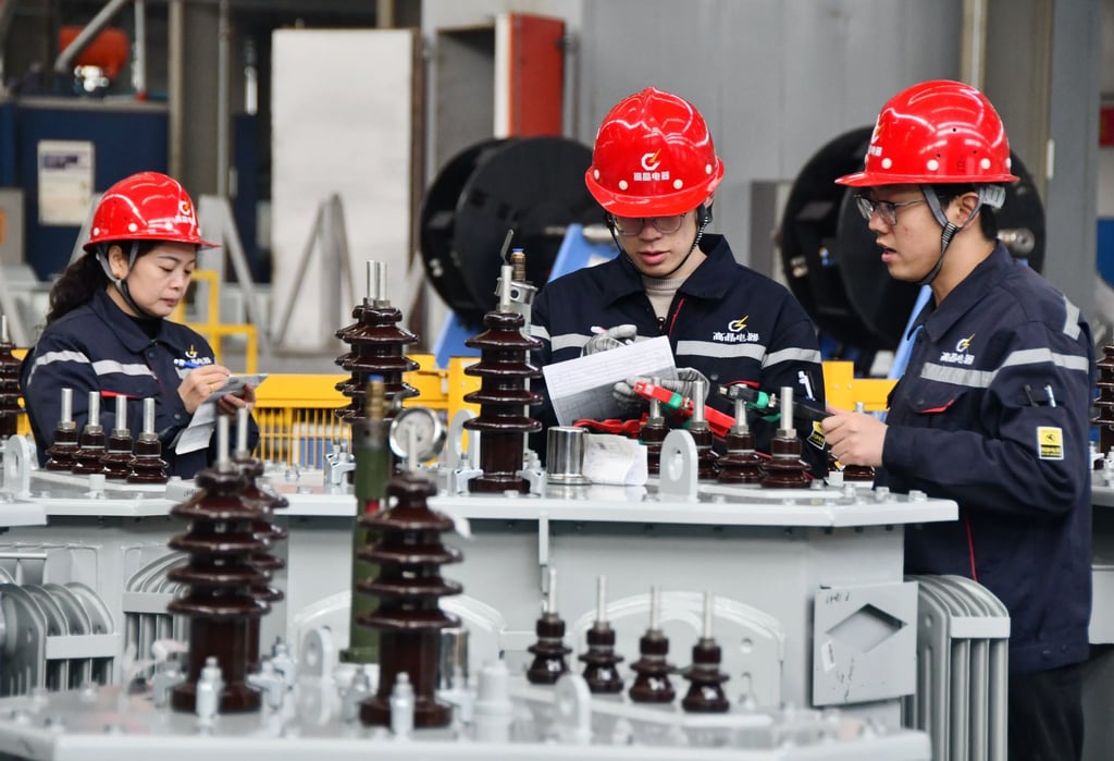 Workers assemble transformers at Hebei Gaojing Electrical Equipment’s factory in Handan, north China’s Hebei province. Photo: CFOTO/Future Publishing via Getty Images
