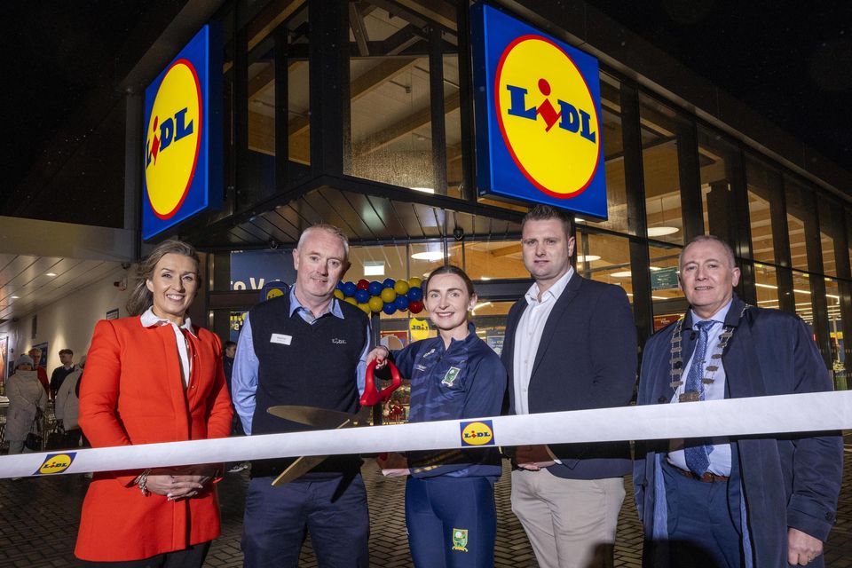 Pictured at the official opening of the new Lidl store in Listowel on Thursday morning are Kim Kerins, Lidl regional sales operations director, Stephen O'Connell, Lidl Listowel store manager and Keith Hogan, Lidl  sales operations manager presenting a cheque for 500 euro to representatives of the Kerry Parents & Friends Association. Photo: Don MacMonagle