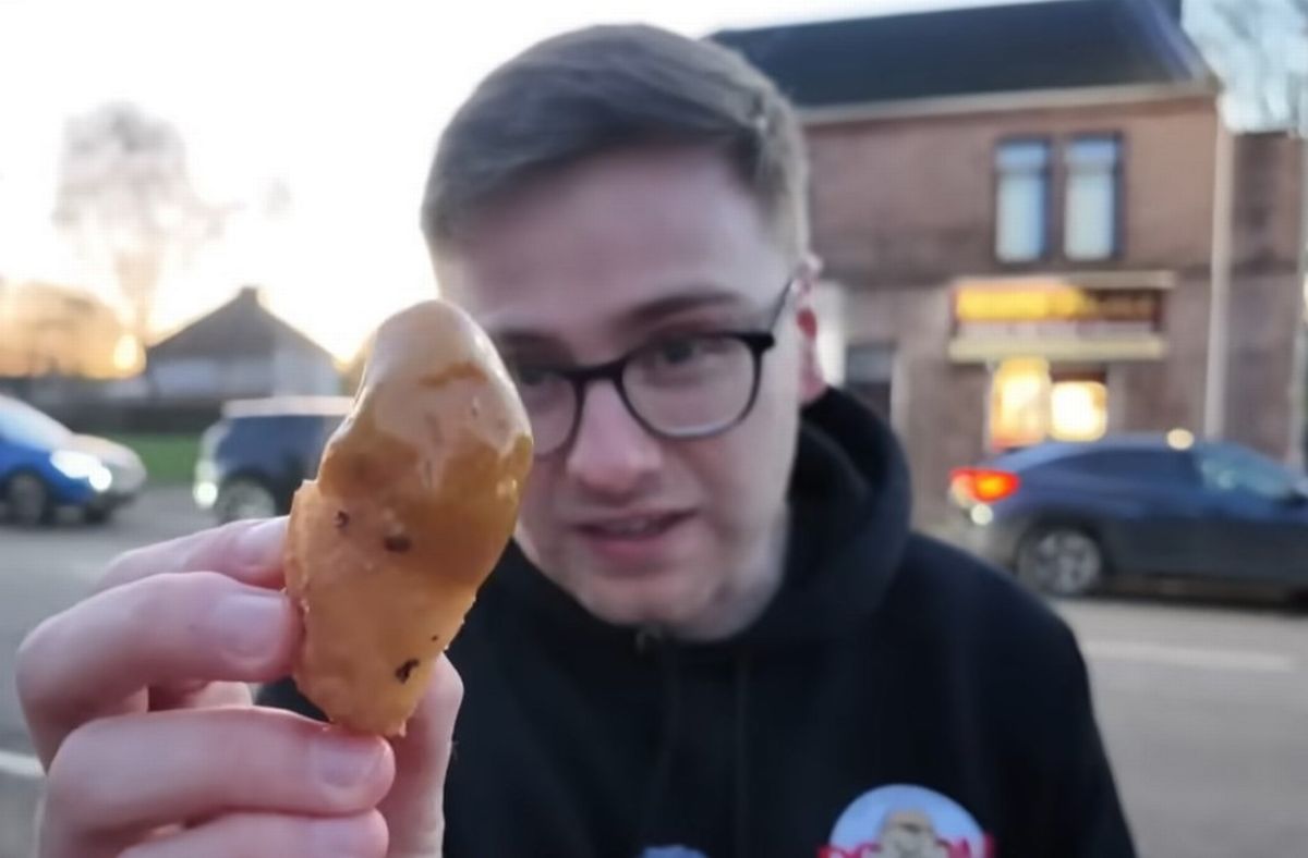 A chicken ball coated in curry sauce 