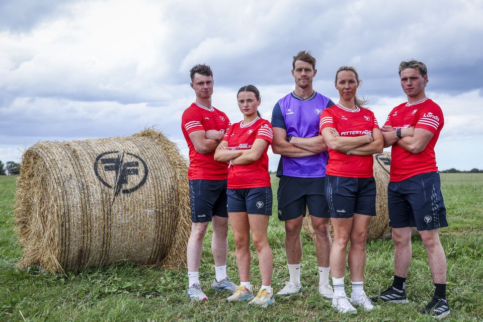 The McKennas and their coach Andrew Trimble.