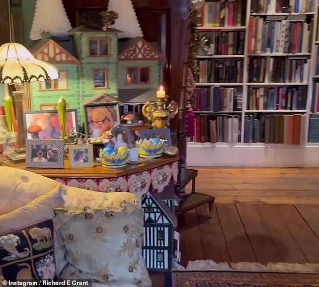 Richard E Grant shows off his vast collection of trinkets at his west London home after filling the Georgian property with career nik-naks and photos of his late wife Joan