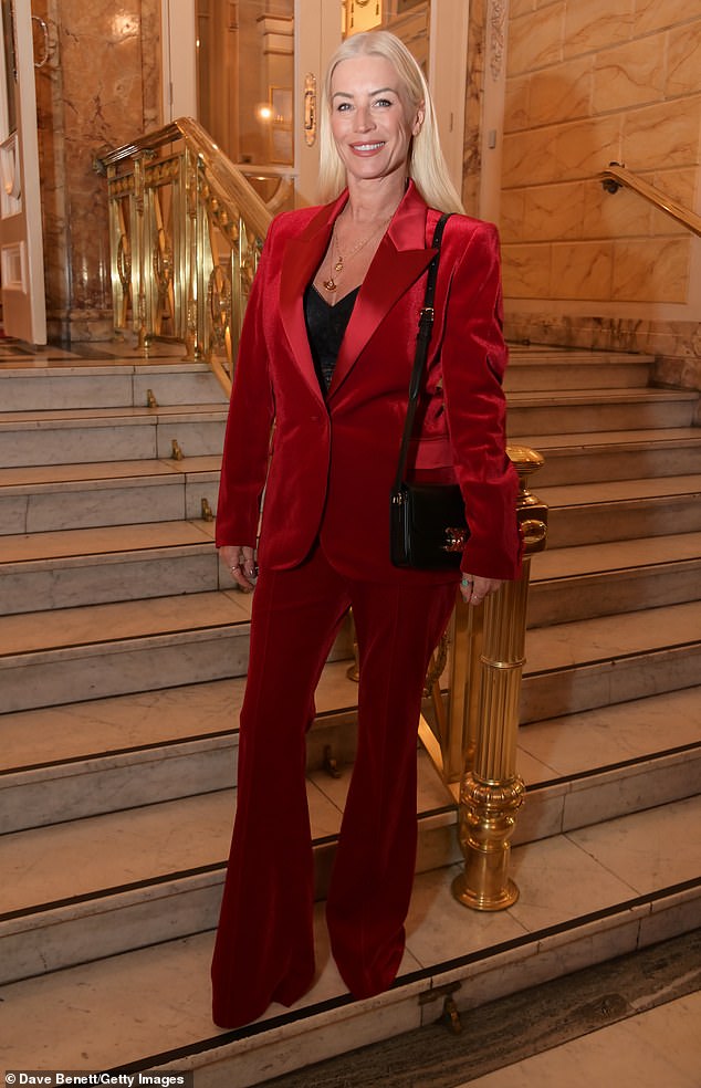 The presenter got into the Christmas spirit in a red velvet trouser suit as she arrived to support the show