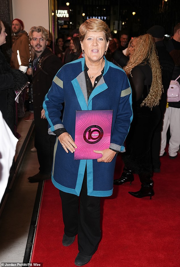 The presenter cut a stylish figure in a dark blue coat with a teal trim as she posed with her programme from the show