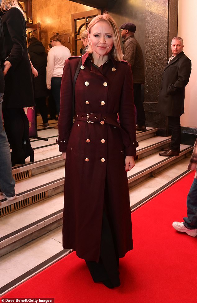 Kimberley Walsh wrapped up warm during the chilly December evening, opting for a stylish dark red double-breasted coat