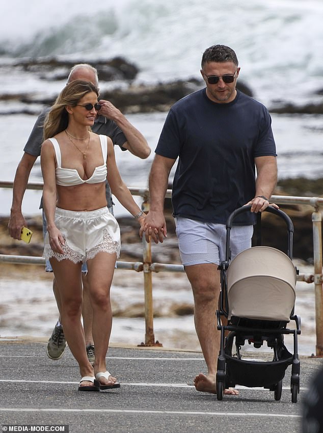Lucy accessorised the chic beach look with oversized sunglasses and a gold necklace, while her blonde hair flowed loosely around her shoulders