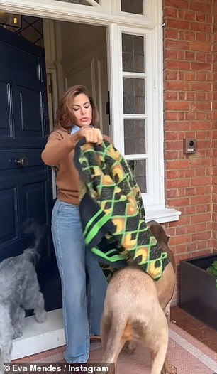 She emerged out her house trying on an array of jackets