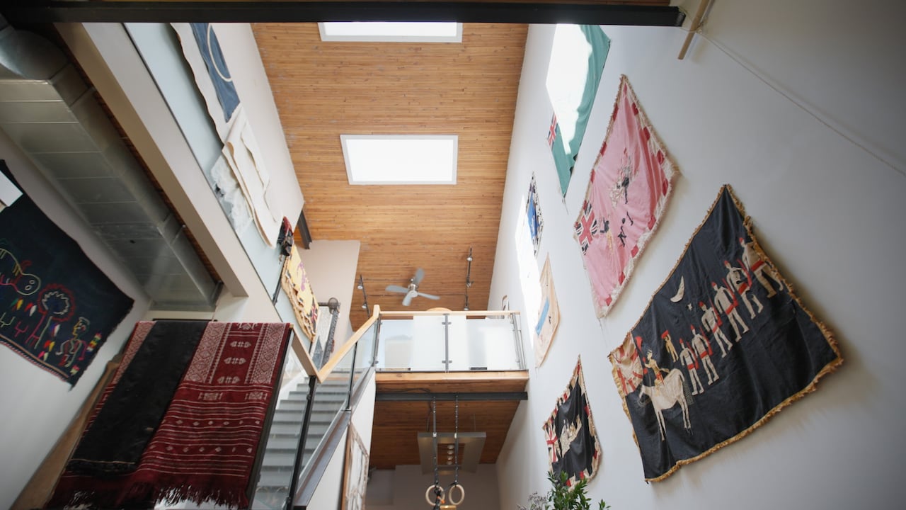 Interior of a 2-storey loft, with ceiling lights in the ceiling. 