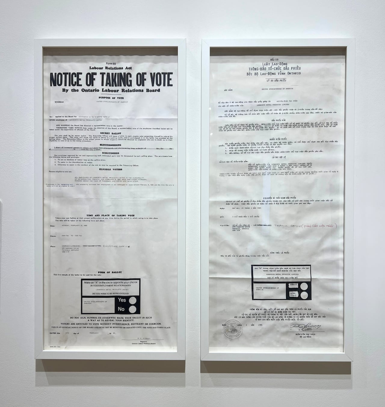 Hanging on a white wall is a two-part notice, one in English and the other in Vietnamese, with the heading "Notice of taking of vote."