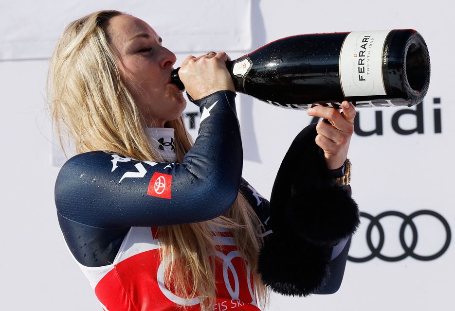 Lindsey Vonn celebrates with champagne. Photo: Reuters/Stefan Wermuth