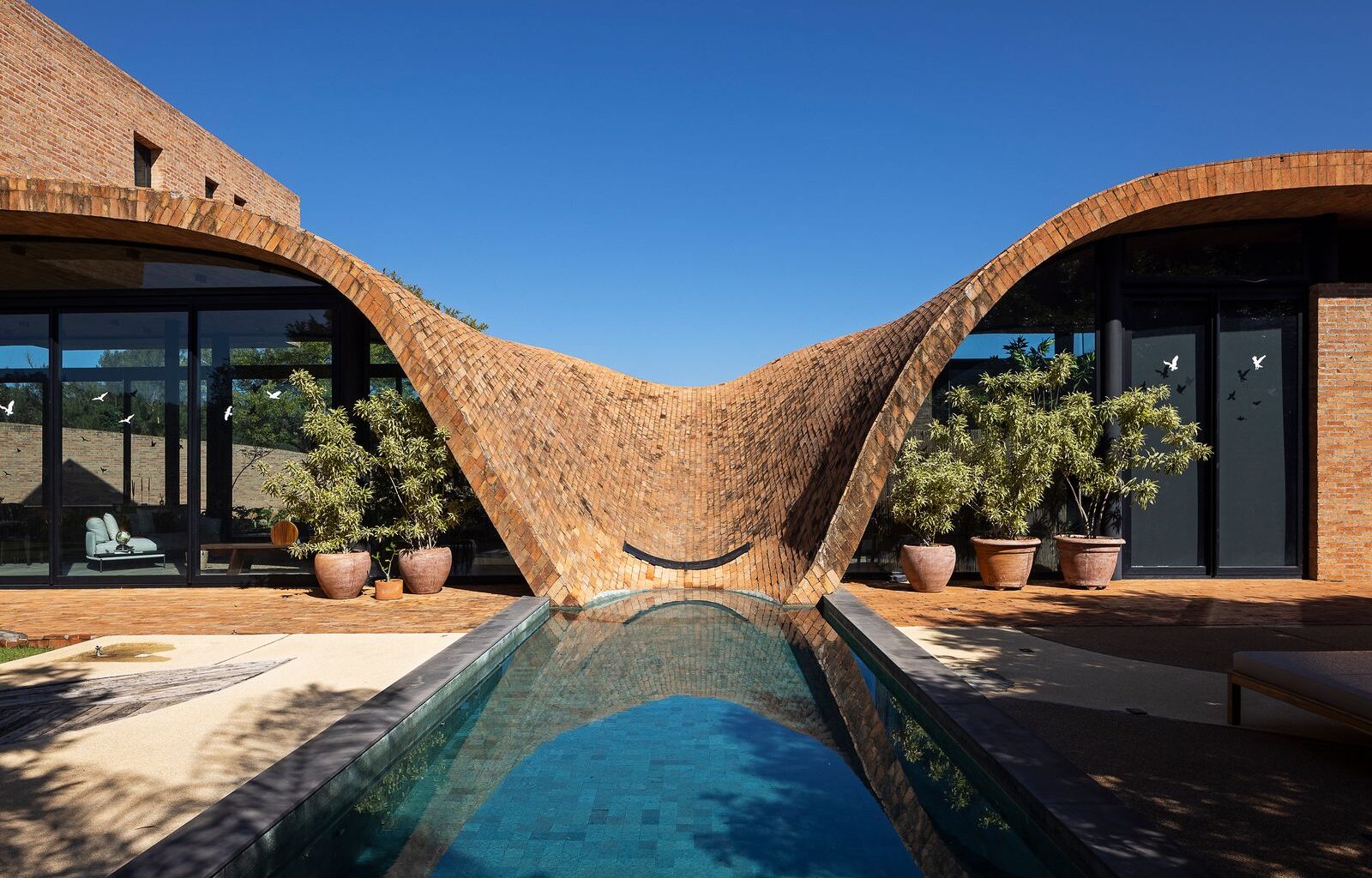 The Roof of This Brazilian Home Takes a Dip in the Pool