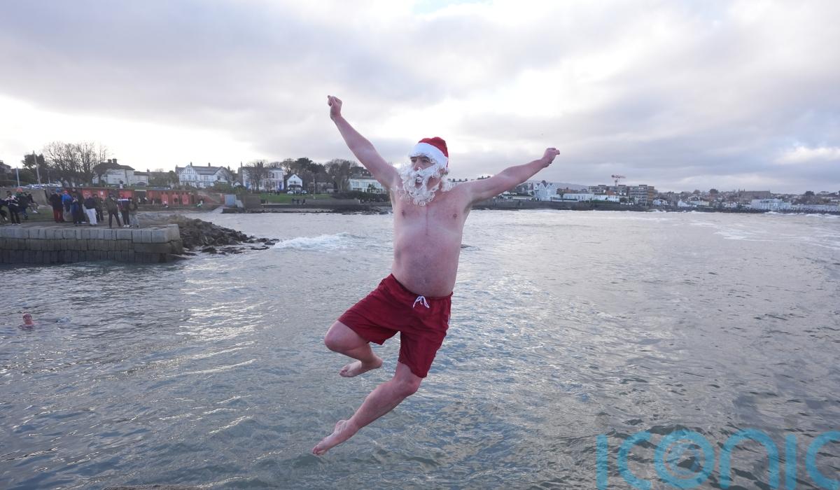 Crowds brave chilly temperatures for Christmas Day swim