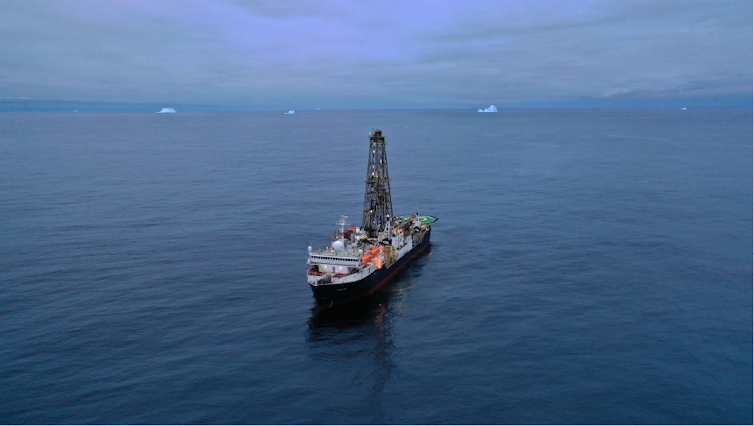 A ship carries a massive tower.