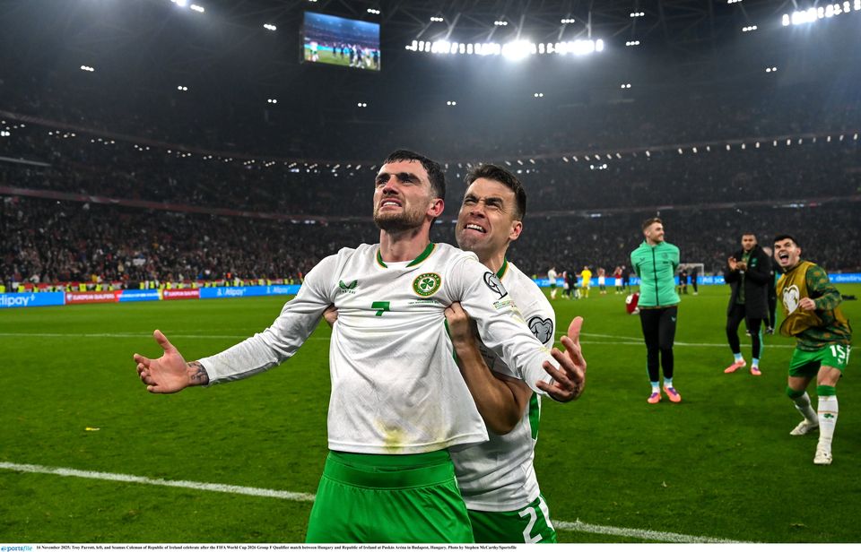 Troy Parrott and Seamus Coleman celebrate after Republic of Ireland secures a place in the World Cup play-off semi-finals. Photo: Stephen McCarthy/Sportsfile