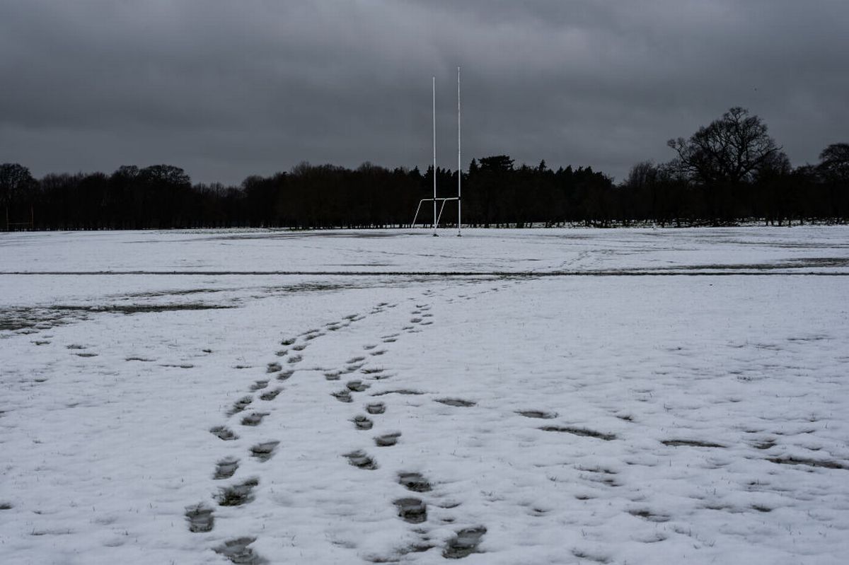 DUBLIN, IRELAND - MARCH 2: Footprints on the snowy foreground can be seen, and a Gaelic football goal posts in the background, on March 2, 2024 in Dublin, Ireland.  Following heavy snowfall across Ireland, a Status Yellow ice warning is in effect with temperatures expected to drop as low as -1 degree according to Met Éireann. (Photo by Natalia Campos/Getty Images)