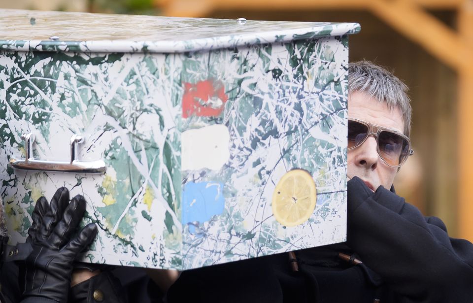 Liam Gallagher carrying Mani’s coffin (Danny Lawson/PA)
