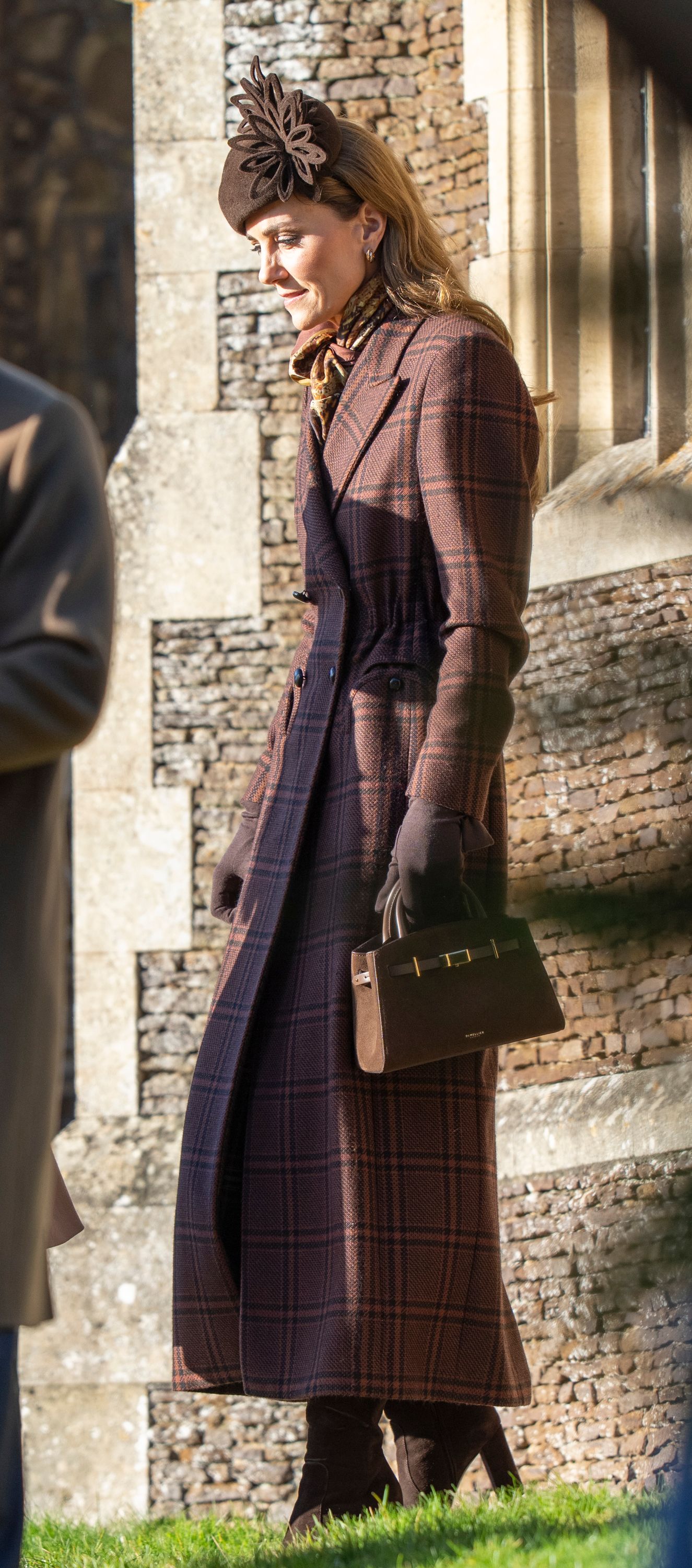 Image may contain Person Clothing Coat Face Head Happy Smile Photography Portrait Adult Scarf and Glove