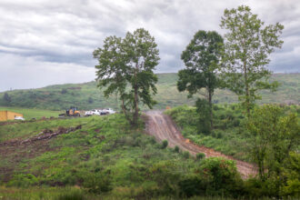 A view of the Westmoreland Sanitary Landfill in Belle Vernon, visible from a strip mall parking lot. Credit: Scott Goldsmith/Inside Climate News