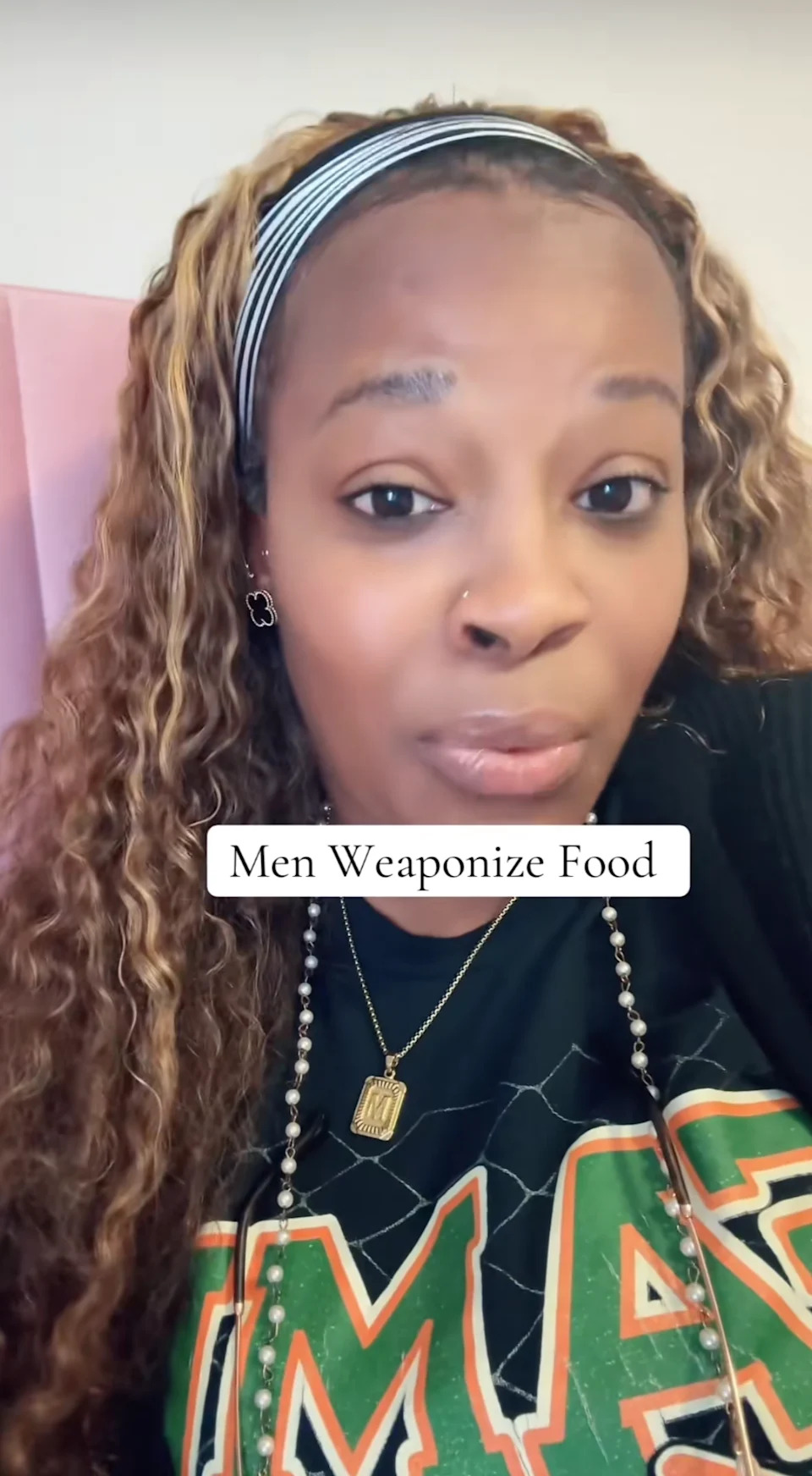 Person wearing a printed shirt and headband, with overlay text saying "Men Weaponize Food."